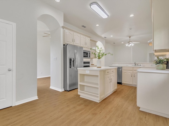 1536 Valley Creek Rd, Denton, TX 76205 - kitchen with appliances with stainless steel finishes, ceiling fan, light wood-style floors, open shelves, and recessed lighting