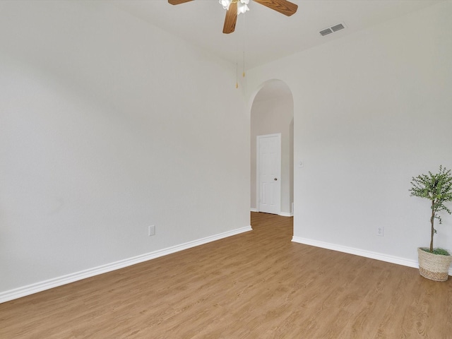 1536 Valley Creek Rd, Denton, TX 76205 - unfurnished room featuring light wood-style flooring, ceiling fan, and arched walkways
