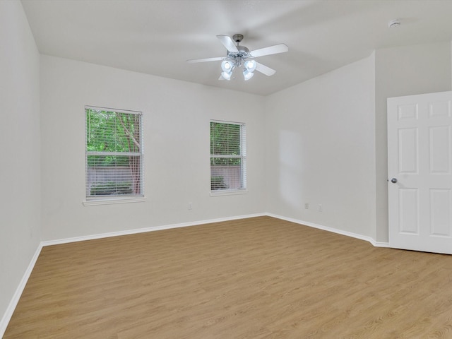 1536 Valley Creek Rd, Denton, TX 76205 - empty room with light wood finished floors, plenty of natural light, ceiling fan, and a smoke detector