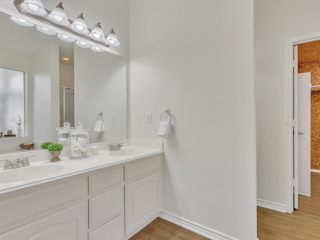 1536 Valley Creek Rd, Denton, TX 76205 - full bath featuring double vanity, wood finished floors, and an enclosed shower