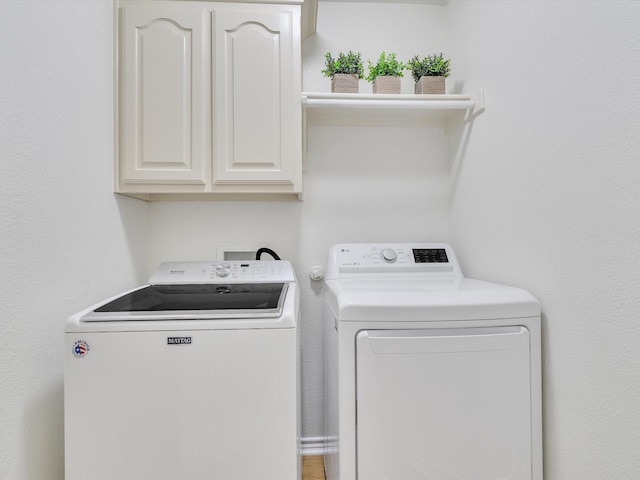 1536 Valley Creek Rd, Denton, TX 76205 - laundry room with washer and clothes dryer and cabinet space