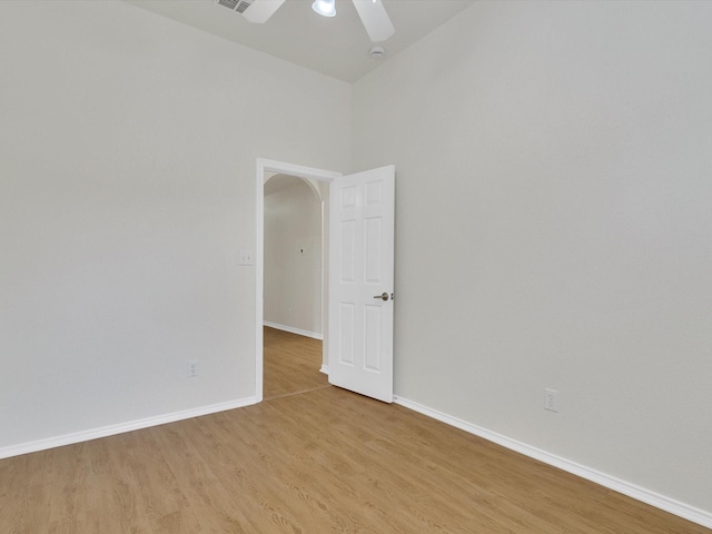 1536 Valley Creek Rd, Denton, TX 76205 - spare room featuring light wood finished floors, arched walkways, ceiling fan, and a smoke detector