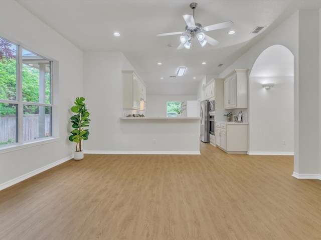 1536 Valley Creek Rd, Denton, TX 76205 - unfurnished living room with healthy amount of natural light, light wood finished floors, a ceiling fan, and recessed lighting