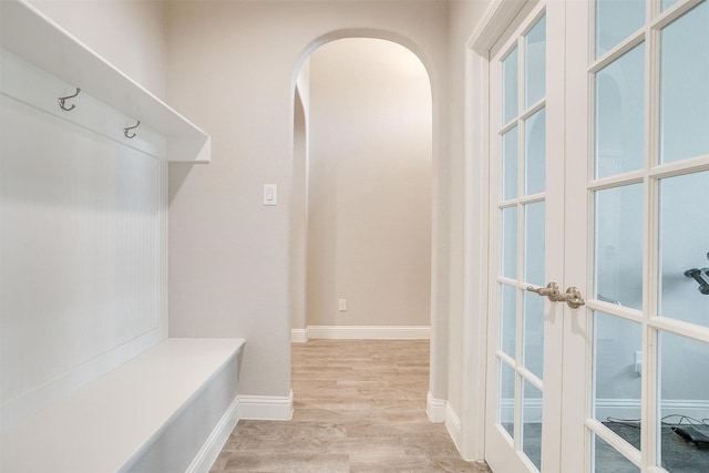 240 Gill Point Ln, Aledo, TX 76008 - mudroom with arched walkways, light wood-type flooring, french doors, and baseboards