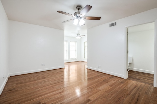 3113 E Park Blvd, Plano, TX 75074 - spare room featuring wood finished floors, a ceiling fan, and baseboards