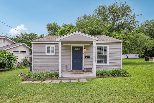 604 N Benge St, Mckinney, TX 75069 - bungalow-style house with a front yard and roof with shingles