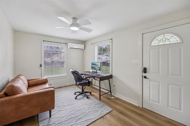 604 N Benge St, Mckinney, TX 75069 - office area featuring a wall mounted AC, a ceiling fan, wood finished floors, and baseboards