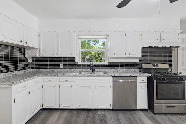 224 Brown Trl, Hurst, TX 76053 - kitchen featuring appliances with stainless steel finishes, a sink, a ceiling fan, and dark wood-style flooring