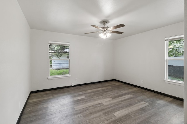 224 Brown Trl, Hurst, TX 76053 - unfurnished room featuring wood finished floors, a ceiling fan, and baseboards