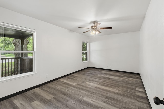 224 Brown Trl, Hurst, TX 76053 - unfurnished room featuring wood finished floors, a ceiling fan, and baseboards