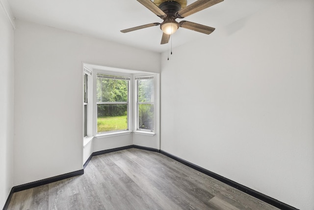 224 Brown Trl, Hurst, TX 76053 - spare room featuring wood finished floors, ceiling fan, and baseboards