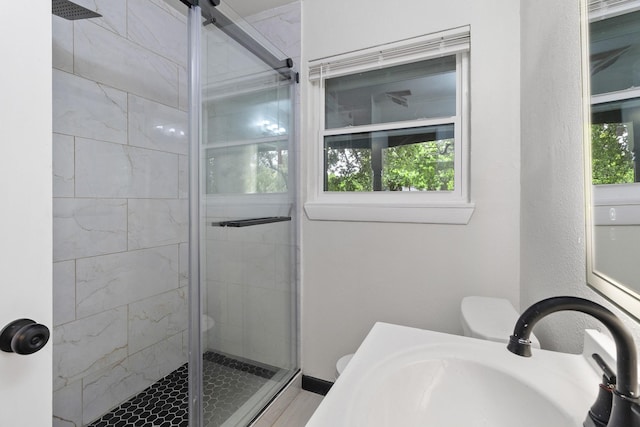 224 Brown Trl, Hurst, TX 76053 - bathroom featuring toilet, a sink, and a shower stall