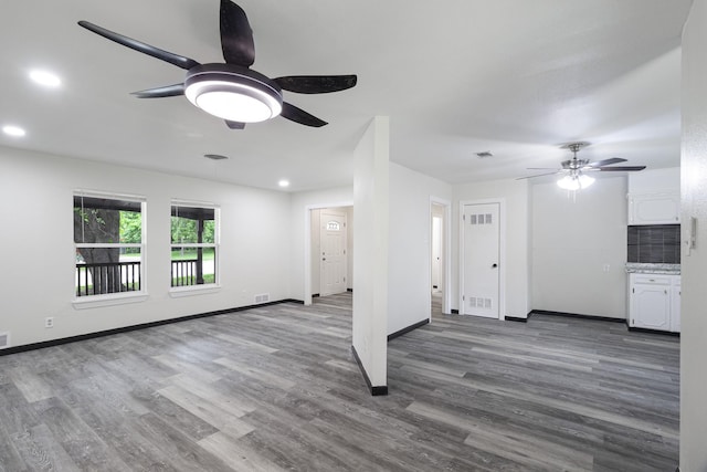 224 Brown Trl, Hurst, TX 76053 - unfurnished living room with ceiling fan, wood finished floors, recessed lighting, and baseboards