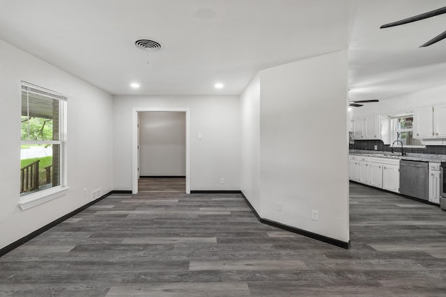 224 Brown Trl, Hurst, TX 76053 - hallway featuring dark wood finished floors, recessed lighting, baseboards, and a sink