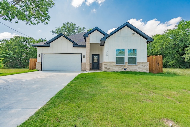 4507 Metropolitan Ave, Dallas, TX 75210 - view of front of home featuring a garage, board and batten siding, driveway, and brick siding