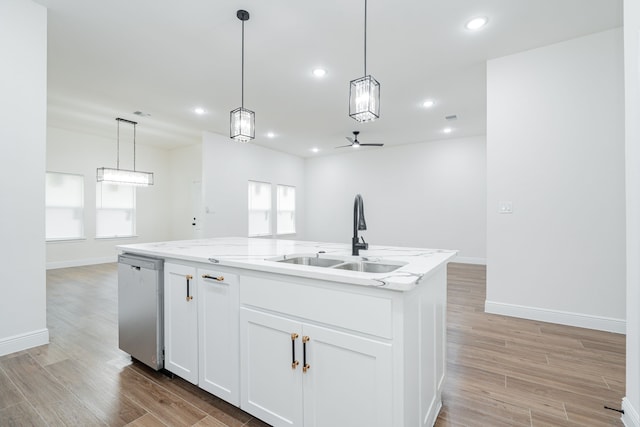 4507 Metropolitan Ave, Dallas, TX 75210 - kitchen with dishwasher, a sink, light wood finished floors, baseboards, and open floor plan