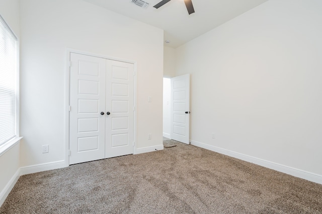 4507 Metropolitan Ave, Dallas, TX 75210 - unfurnished bedroom with carpet, a closet, baseboards, and a ceiling fan