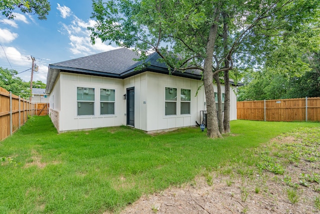 4507 Metropolitan Ave, Dallas, TX 75210 - back of house with a shingled roof and board and batten siding