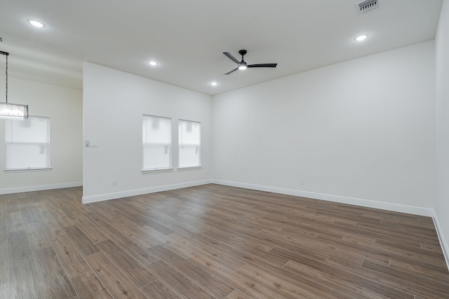 4507 Metropolitan Ave, Dallas, TX 75210 - unfurnished room with ceiling fan, wood finished floors, baseboards, a chandelier, and recessed lighting