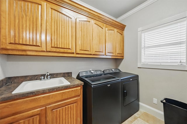 175 Robnett Rd, Waxahachie, TX 75165 - laundry room with washing machine and dryer, cabinet space, ornamental molding, and baseboards