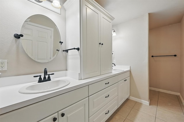 175 Robnett Rd, Waxahachie, TX 75165 - bathroom featuring double vanity, tile patterned floors, and baseboards