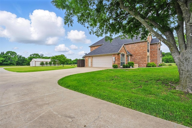 175 Robnett Rd, Waxahachie, TX 75165 - traditional-style house with brick siding, driveway, a front yard, and an attached garage