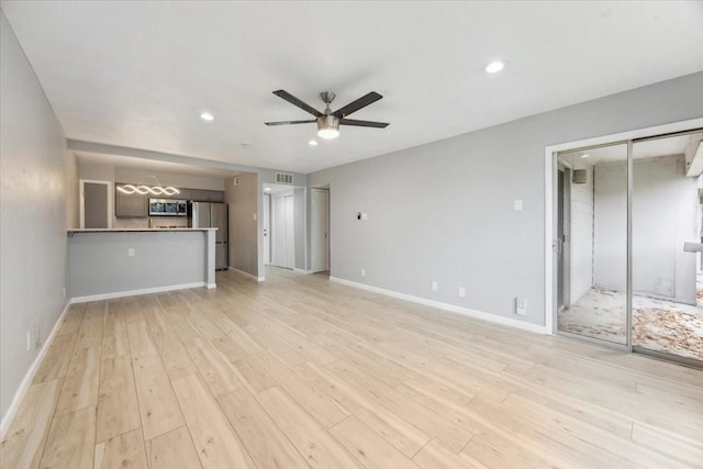 4837 Cedar Springs Rd Unit 321, Dallas, TX 75219 - unfurnished living room with a ceiling fan, light wood finished floors, recessed lighting, and baseboards