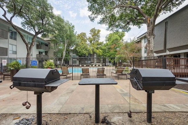 4837 Cedar Springs Rd Unit 321, Dallas, TX 75219 - view of patio featuring a grill