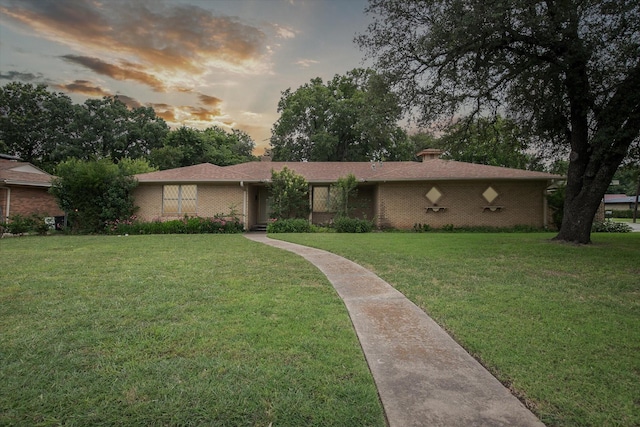 7200 Brooks Ave, Richland Hills, TX 76118 - ranch-style house with a front yard and brick siding