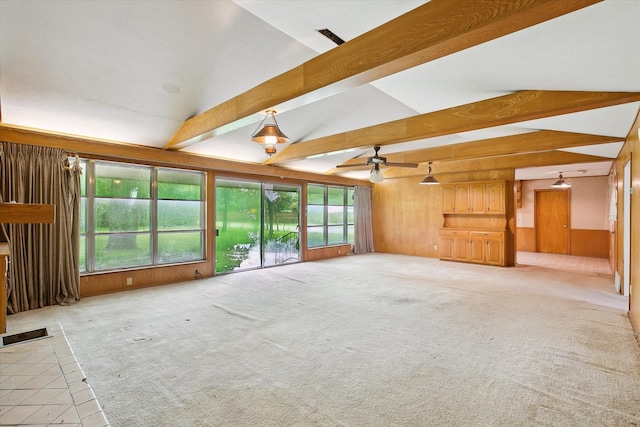 7200 Brooks Ave, Richland Hills, TX 76118 - unfurnished living room featuring wood walls, ceiling fan, and light carpet