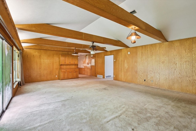 7200 Brooks Ave, Richland Hills, TX 76118 - unfurnished living room with wood walls, ceiling fan, and carpet flooring