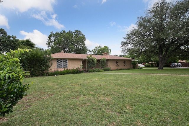 7200 Brooks Ave, Richland Hills, TX 76118 - ranch-style house featuring a front yard, brick siding, and a chimney