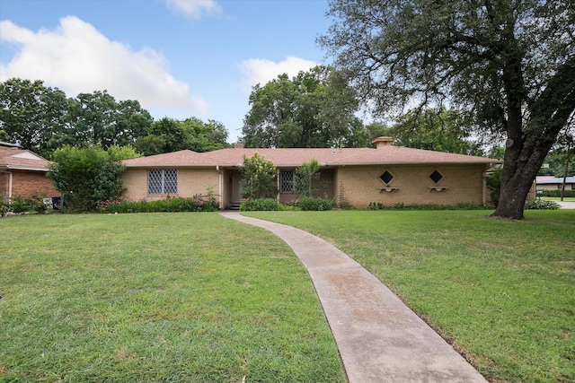 7200 Brooks Ave, Richland Hills, TX 76118 - single story home with a front yard, a chimney, and brick siding