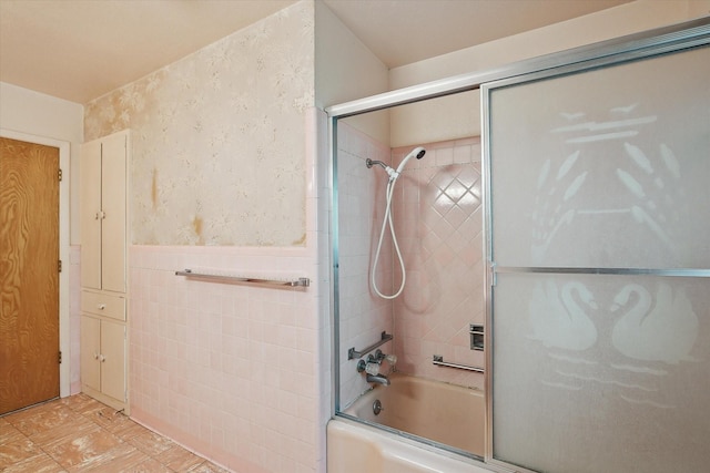 7200 Brooks Ave, Richland Hills, TX 76118 - bathroom featuring enclosed tub / shower combo, wallpapered walls, wainscoting, and tile walls