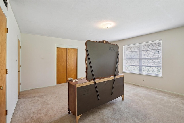 7200 Brooks Ave, Richland Hills, TX 76118 - bedroom with light colored carpet, a closet, and baseboards