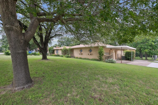 7200 Brooks Ave, Richland Hills, TX 76118 - view of front of house with brick siding, concrete driveway, and a carport