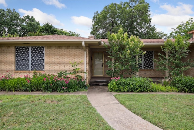 7200 Brooks Ave, Richland Hills, TX 76118 - view of front of home featuring brick siding and a front lawn