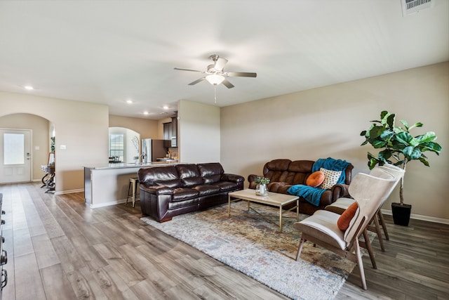 203 Lake Rdg, Princeton, TX 75407 - living area featuring arched walkways, recessed lighting, light wood-style floors, ceiling fan, and baseboards