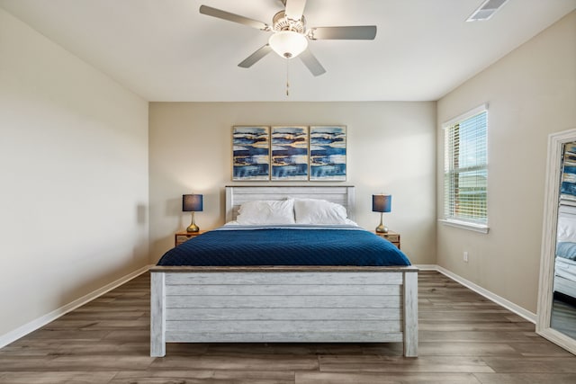 203 Lake Rdg, Princeton, TX 75407 - bedroom with baseboards, wood finished floors, and ceiling fan