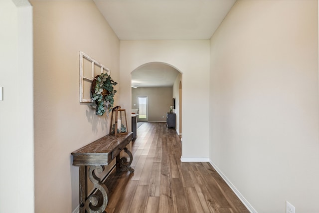 203 Lake Rdg, Princeton, TX 75407 - hallway featuring arched walkways, wood finished floors, and baseboards