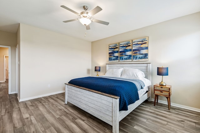 203 Lake Rdg, Princeton, TX 75407 - bedroom with wood finished floors, baseboards, and ceiling fan