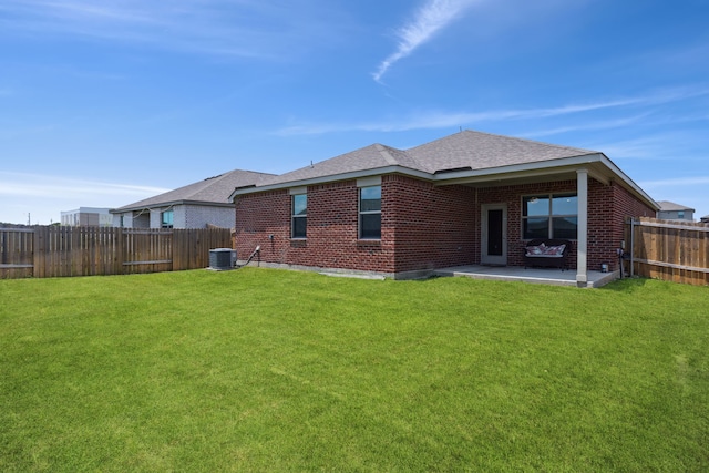 203 Lake Rdg, Princeton, TX 75407 - rear view of house with a patio, brick siding, roof with shingles, and cooling unit