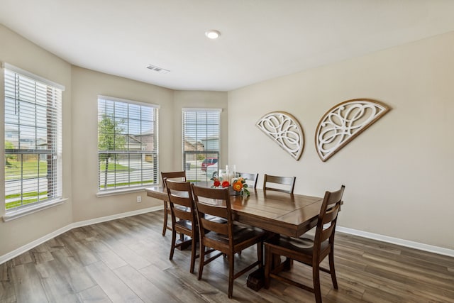 203 Lake Rdg, Princeton, TX 75407 - dining area featuring healthy amount of natural light, dark wood-style floors, and baseboards