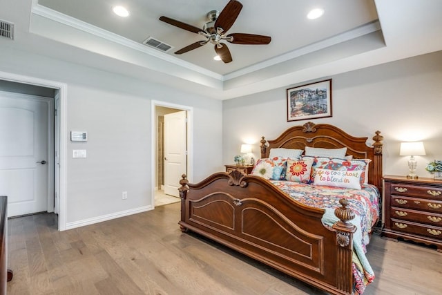 7812 Gulf Breeze Ln, Frisco, TX 75036 - bedroom featuring a tray ceiling, wood finished floors, recessed lighting, ornamental molding, and baseboards