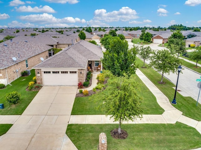 7812 Gulf Breeze Ln, Frisco, TX 75036 - view of front facade with a garage, a residential view, concrete driveway, and a front yard