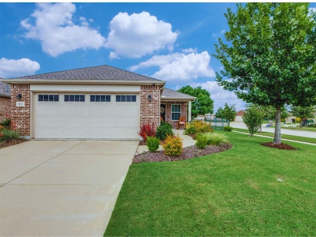 7812 Gulf Breeze Ln, Frisco, TX 75036 - view of front of house featuring brick siding, a front yard, concrete driveway, and an attached garage