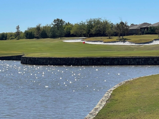 7812 Gulf Breeze Ln, Frisco, TX 75036 - view of property's community with a yard, golf course view, and a water view