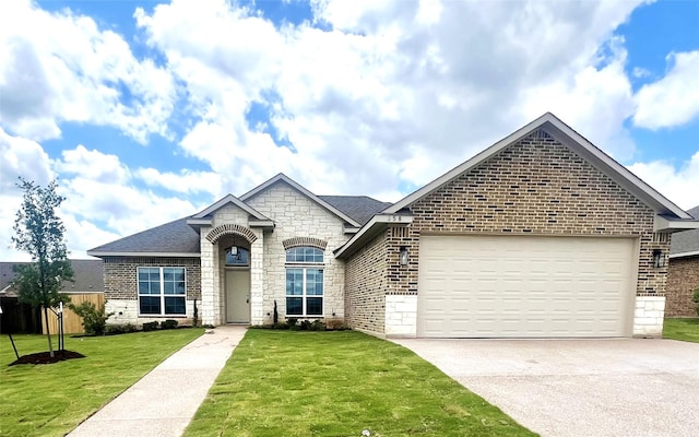 358 Frederick Dr, Robinson, TX 76706 - french provincial home featuring brick siding, concrete driveway, and an attached garage