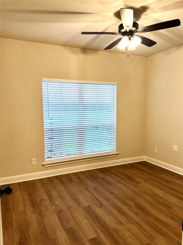 358 Frederick Dr, Robinson, TX 76706 - empty room featuring a ceiling fan, dark wood-style flooring, and baseboards
