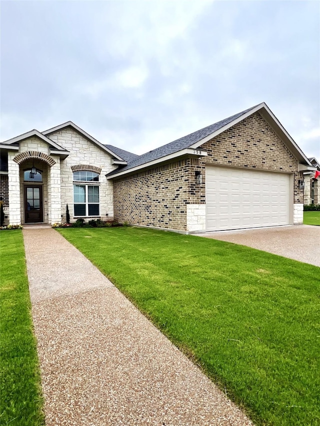 358 Frederick Dr, Robinson, TX 76706 - view of front facade with an attached garage, a front lawn, brick siding, and concrete driveway